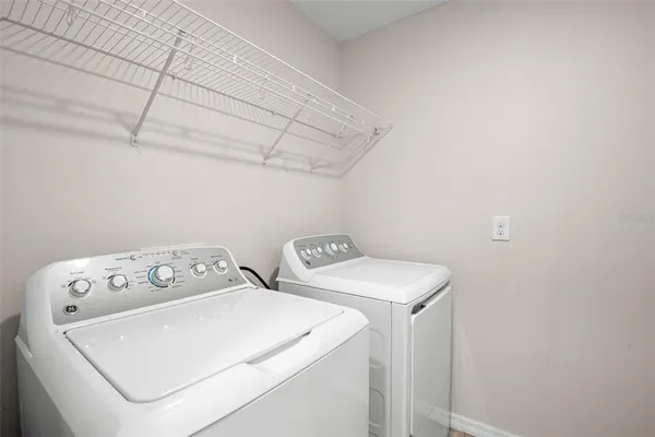 a utility room with dryer and washer