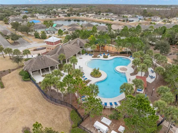 an aerial view of a house with yard