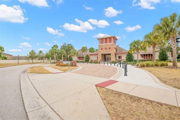 a swimming pool with buildings in the background