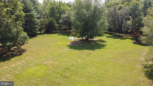 a view of a yard with swimming pool