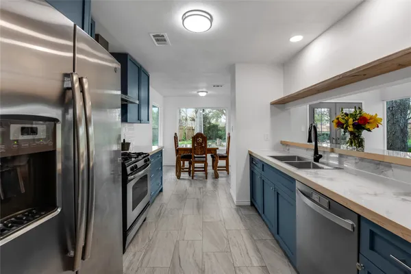 a kitchen with a sink and a window