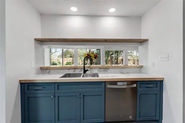 a bathroom with a toilet sink and shower