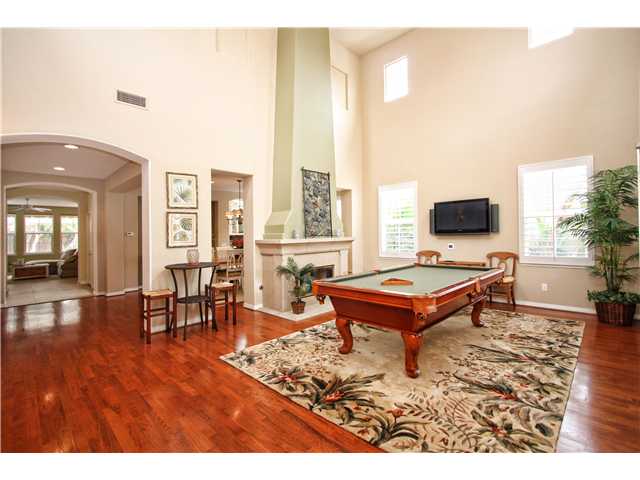 536 Rudder Avenue Carlsbad, CA 92011 - Photo 2 of 20 Living room with wood flooring and fireplace. Currently used as the game room.