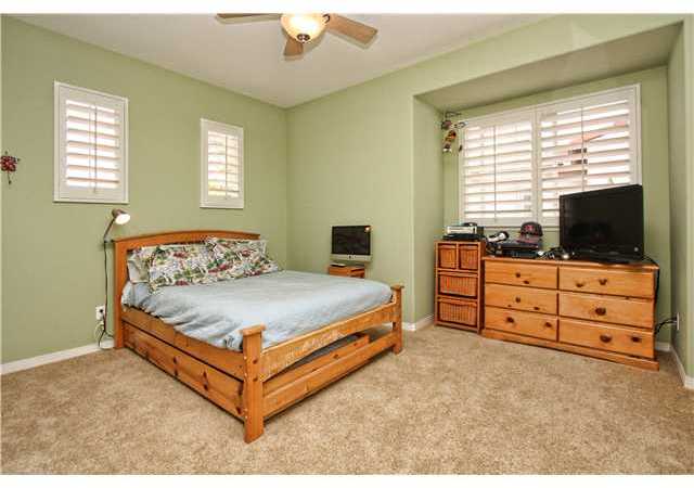 536 Rudder Avenue Carlsbad, CA 92011 - Photo 13 of 20 Upstairs bedroom with ceiling fan and plantation shutters.