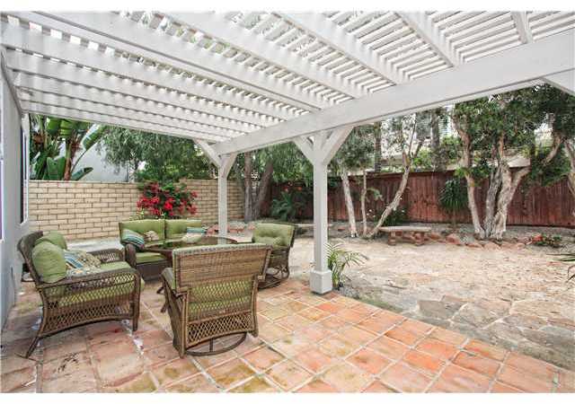 536 Rudder Avenue Carlsbad, CA 92011 - Photo 16 of 20 Easy care landscaped rear fenced yard with patio covering, saltillo and stone.