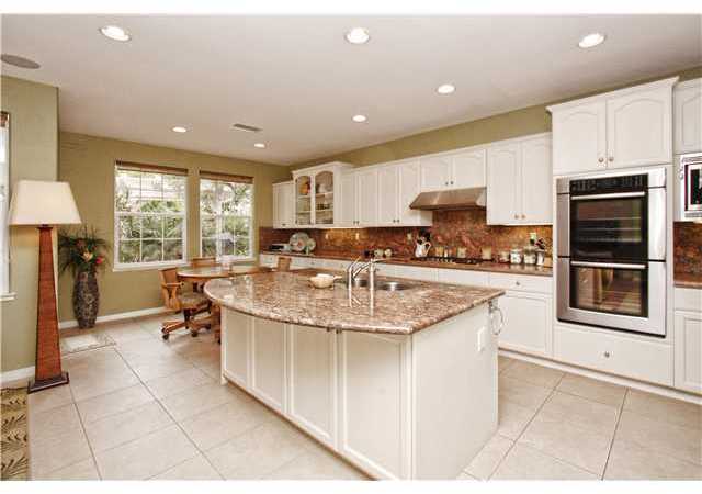 536 Rudder Avenue Carlsbad, CA 92011 - Photo 6 of 20 Gourmet kitchen with granite island and counter tops, breakfast area, custom cabinets, high end Bosch applicances.