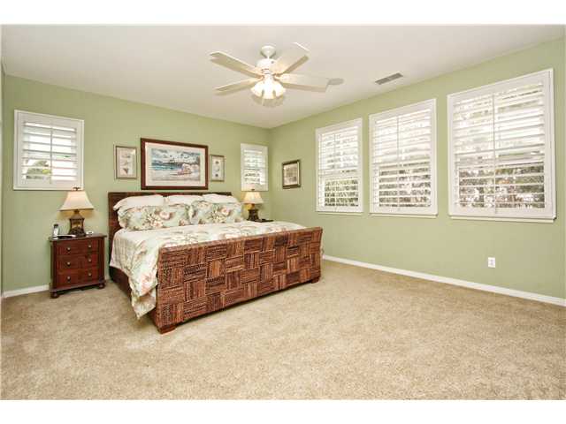 536 Rudder Avenue Carlsbad, CA 92011 - Photo 9 of 20 Master bedroom with ceiling fan, plantation shutters, walk-in closet.