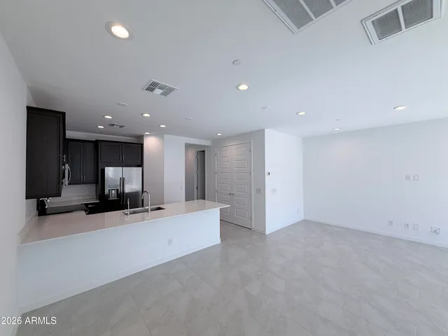 a view of a kitchen with a sink and a microwave
