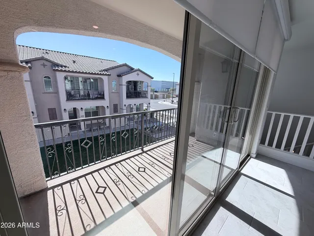 a view of balcony with wooden floor