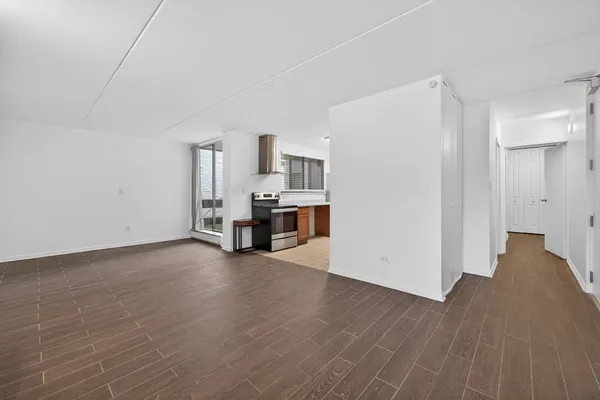 a view of kitchen with furniture and wooden floor