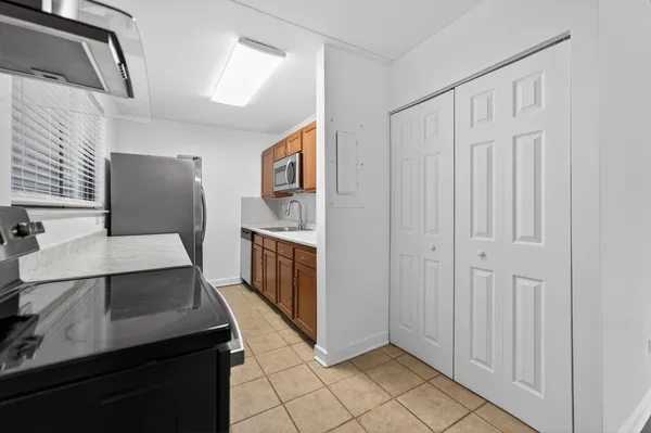 a kitchen with stainless steel appliances a refrigerator and a stove