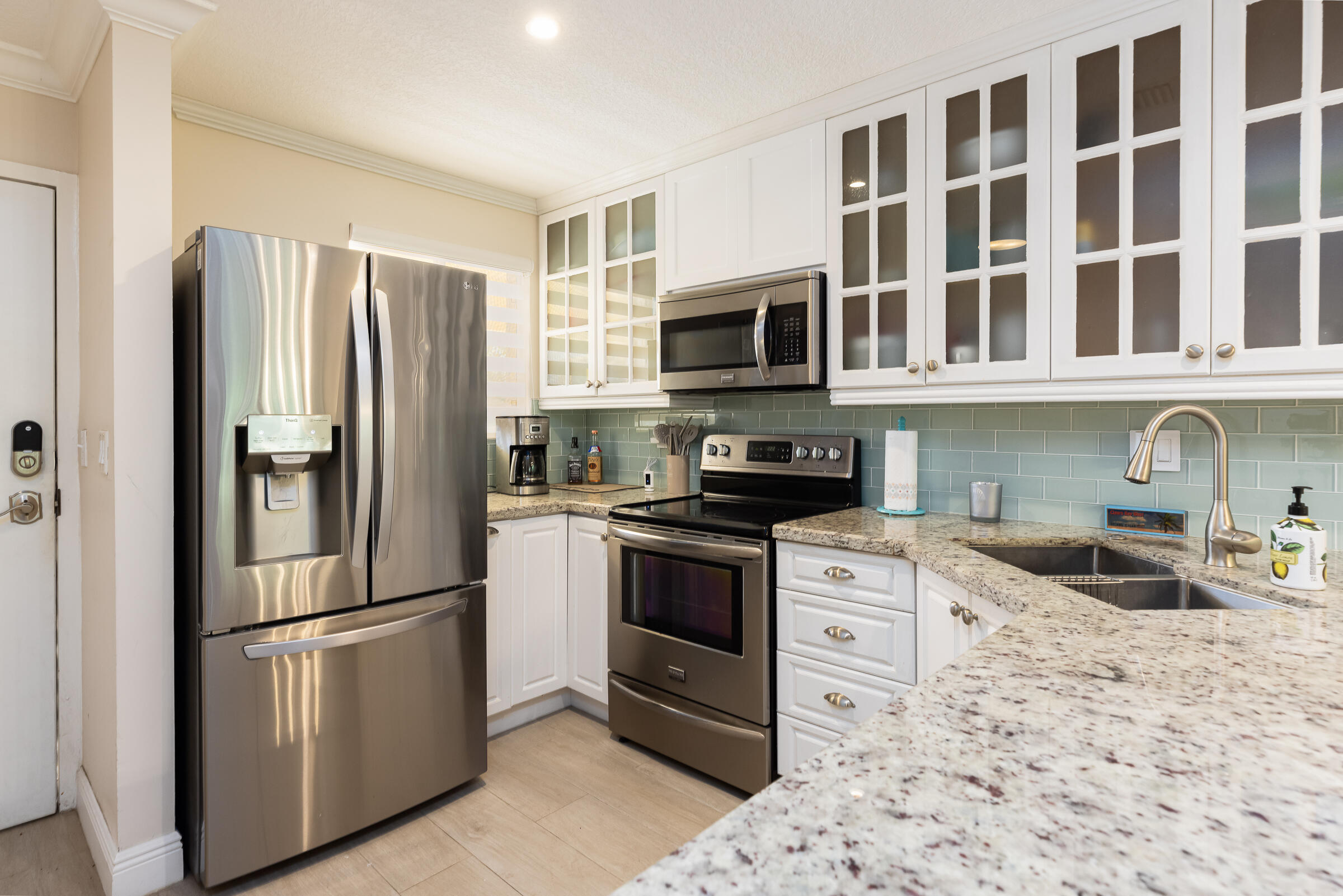 98222 Windward Avenue Key Largo, FL 33037 - Photo 9 of 41 a kitchen with stainless steel appliances granite countertop a refrigerator stove and oven