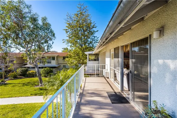 a bedroom with a bed and a dresser in it