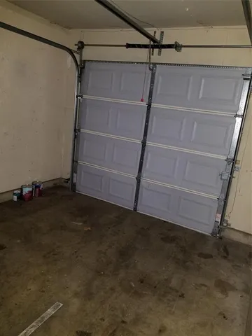 a view of backyard with wooden fence