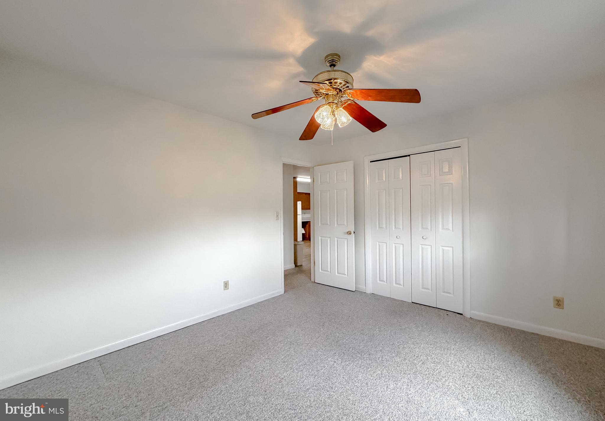 7615 Mill Creek Road Benedict, MD 20612 - Photo 22 of 37 an empty room with closet and a chandelier fan