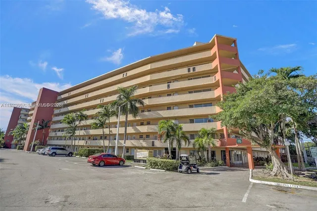 a view of a porch with furniture and a yard