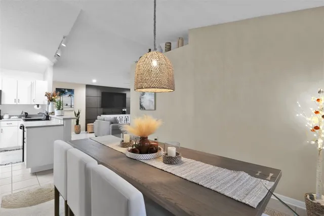 a kitchen with a table and chairs