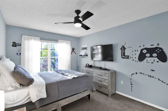 a bed room with a bed and a window