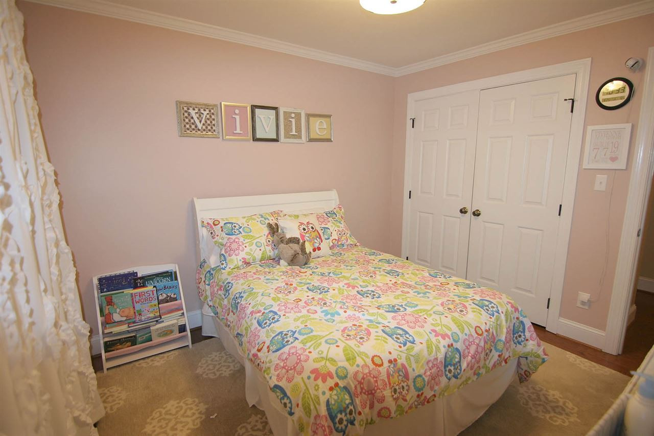 7903 Laurel Mountain Road Raleigh, NC 27613 - Photo 19 of 25 Secondary Bedroom has Hardwood Floors & Double Closet Bedroom