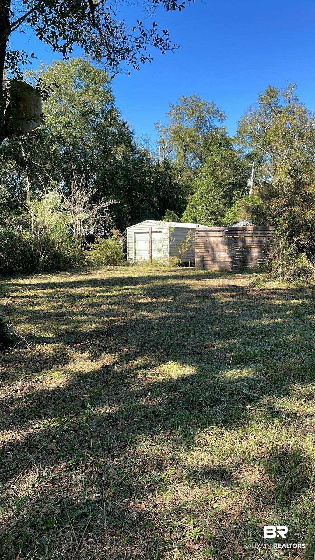 18743 Keller Road Foley, AL 36535 - Photo 20 of 21 View of grassy yard featuring an outdoor structure