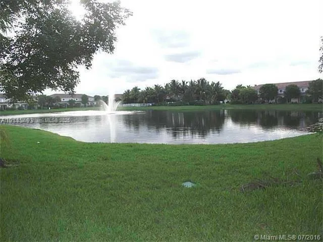 a view of a lake with a large trees