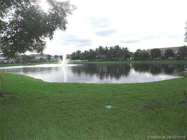 2551 Southwest 83rd Avenue, Unit 107 Miramar, FL 33025 - Photo 17 of 19 a view of a lake with a large trees