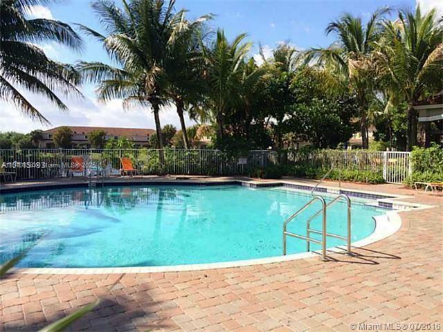 2551 Southwest 83rd Avenue, Unit 107 Miramar, FL 33025 - Photo 18 of 19 a view of a swimming pool with a patio