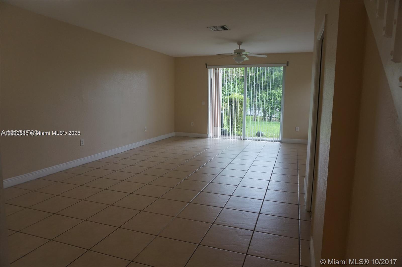 2551 Southwest 83rd Avenue, Unit 107 Miramar, FL 33025 - Photo 9 of 19 a view of an empty room and window