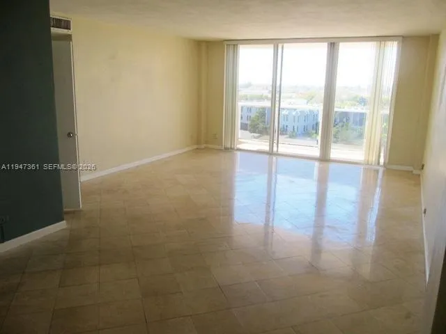 a view of an empty room and window