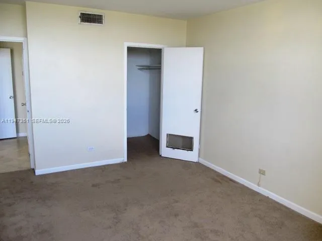 an empty room with entrance door