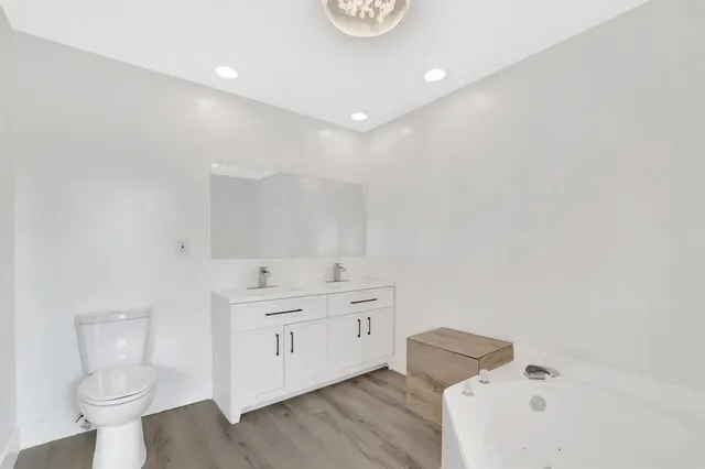 a bathroom with a bathtub and a window