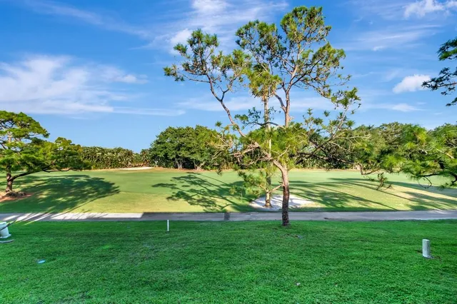 an aerial view of residential houses with outdoor space and swimming pool