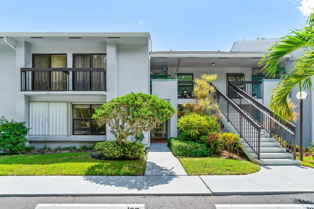 an aerial view of a city with a lake view