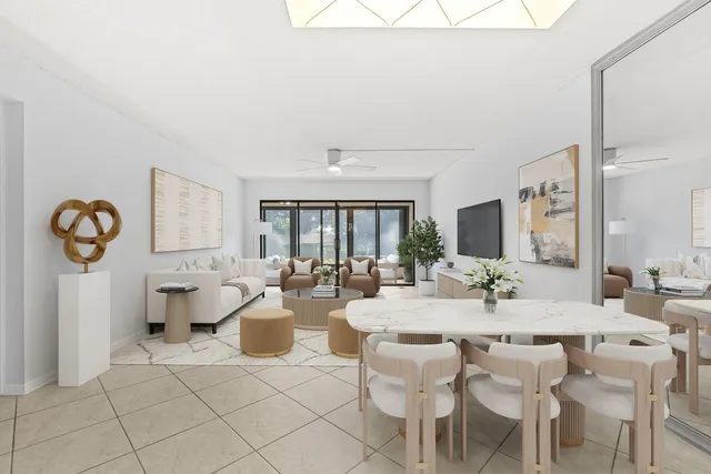 an aerial view of a house with swimming pool garden and lake view