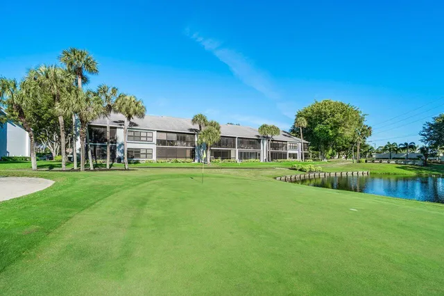 view of a pool with a yard