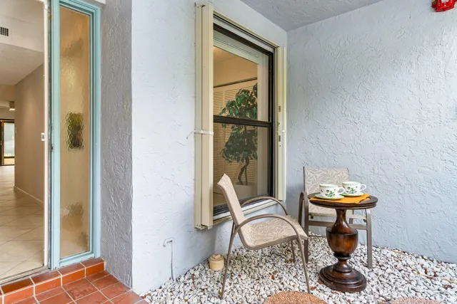 a kitchen with white cabinets sink and stainless steel appliances