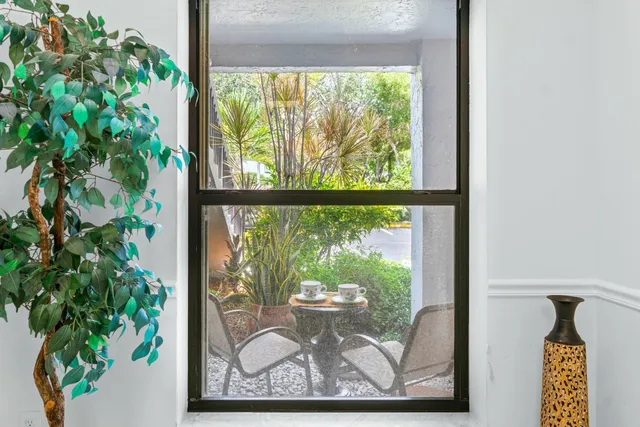 a kitchen with stainless steel appliances granite countertop a sink and a refrigerator