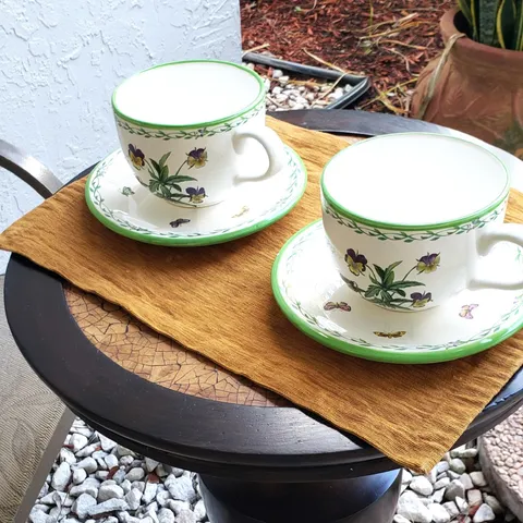 a living room with a large bed and a flat screen tv