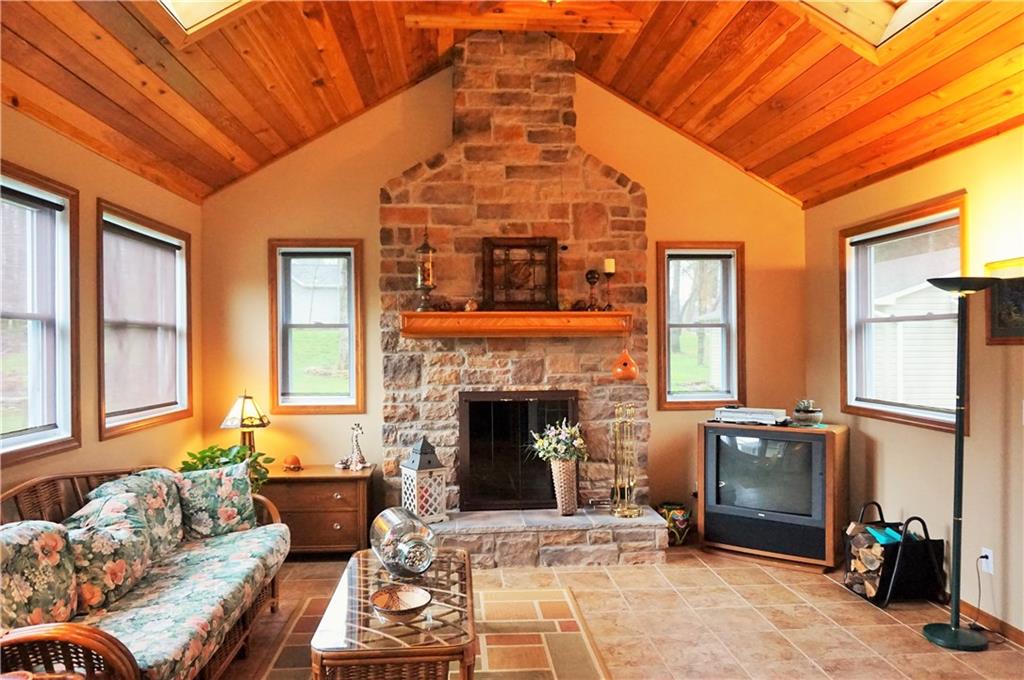 421 Kriess Road Renfrew, PA 16053 - Photo 17 of 25 The beautiful 4 seasons room with wood burning fireplace!