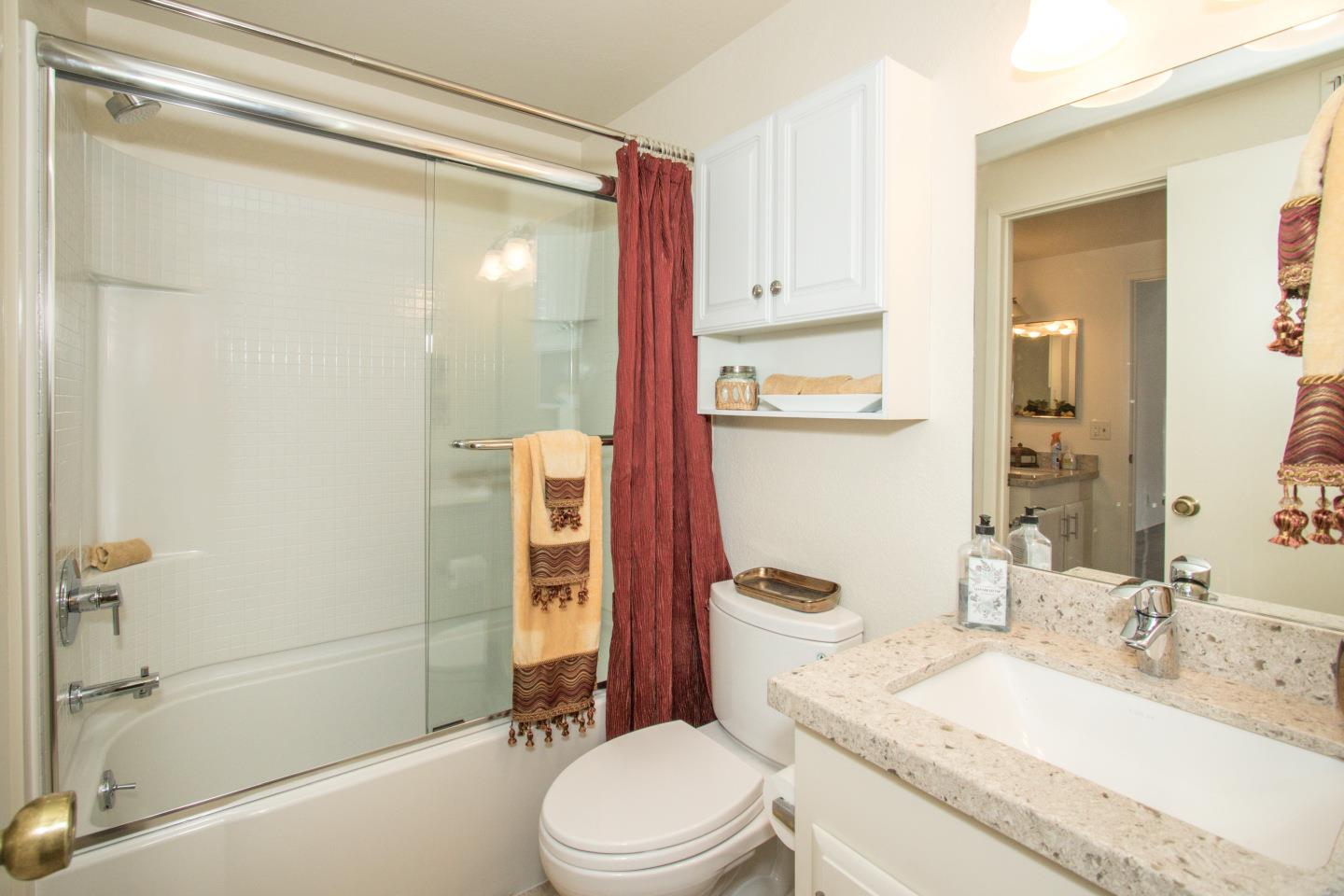 740 Pinta Lane Foster City, CA 94404 - Photo 20 of 33 a bathroom with a granite countertop sink toilet and shower
