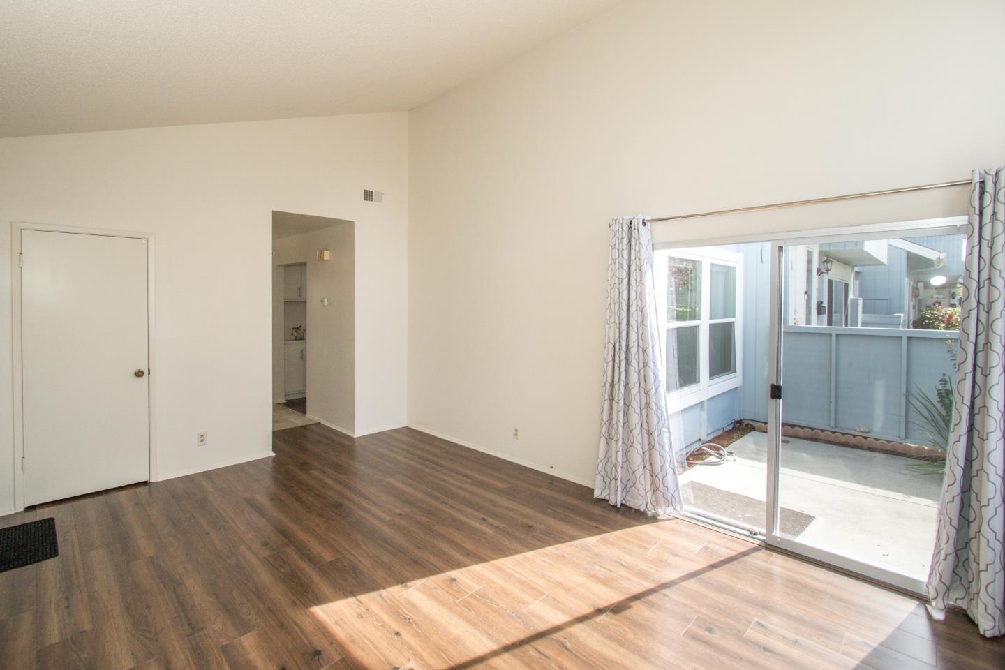 740 Pinta Lane Foster City, CA 94404 - Photo 9 of 33 a view of a room with wooden floor and a backyard
