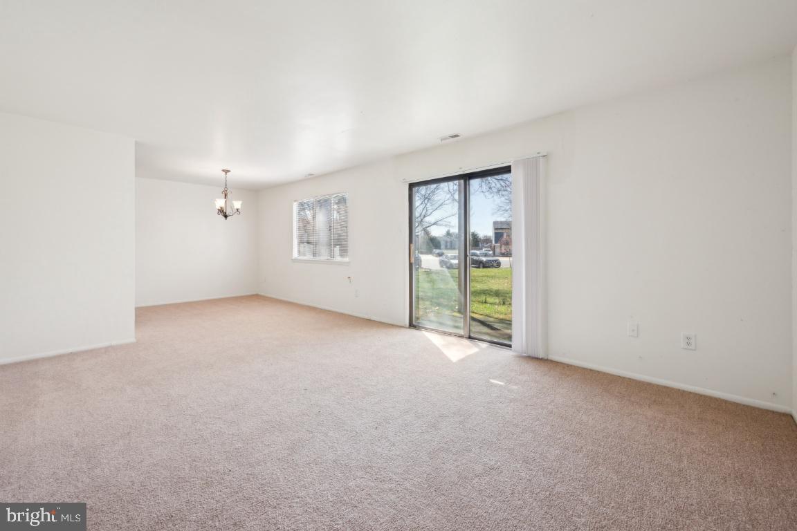 58 Sandra Road Voorhees, NJ 08043 - Photo 2 of 25 a view of an empty room with a window