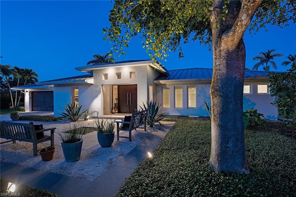 1600 Murex Lane Naples, FL 34102 - Photo 1 of 25 a view of a house with a patio