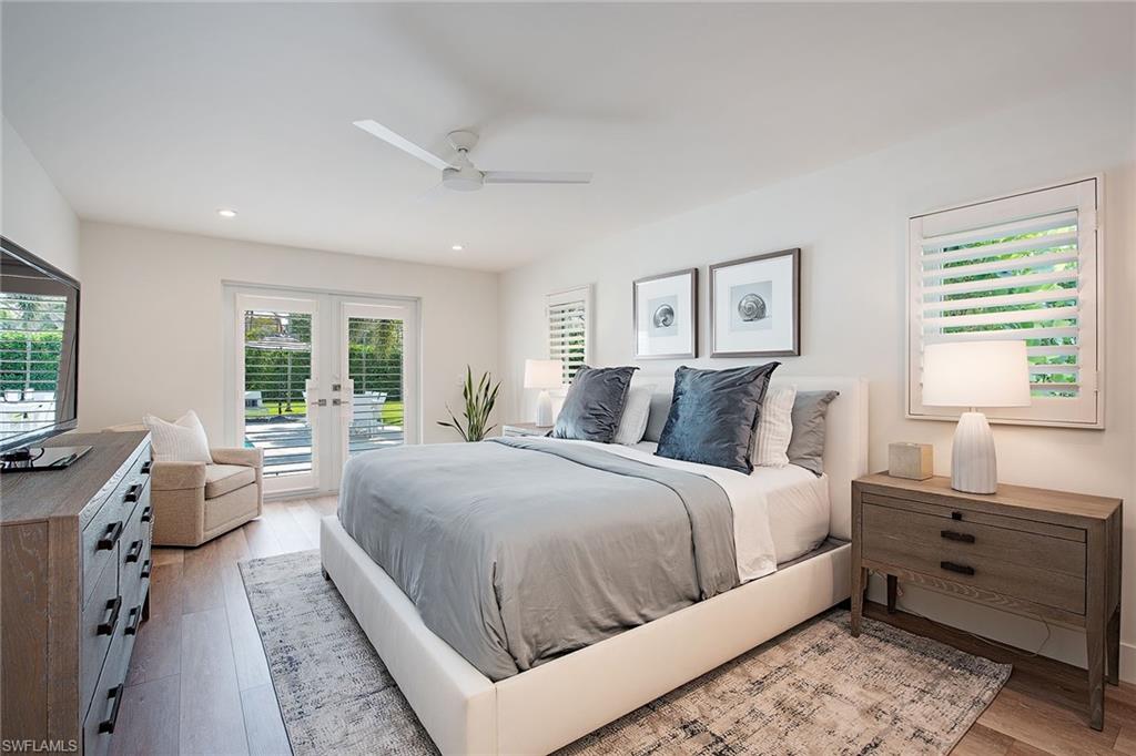 1600 Murex Lane Naples, FL 34102 - Photo 13 of 25 a bed room with a bed and a window