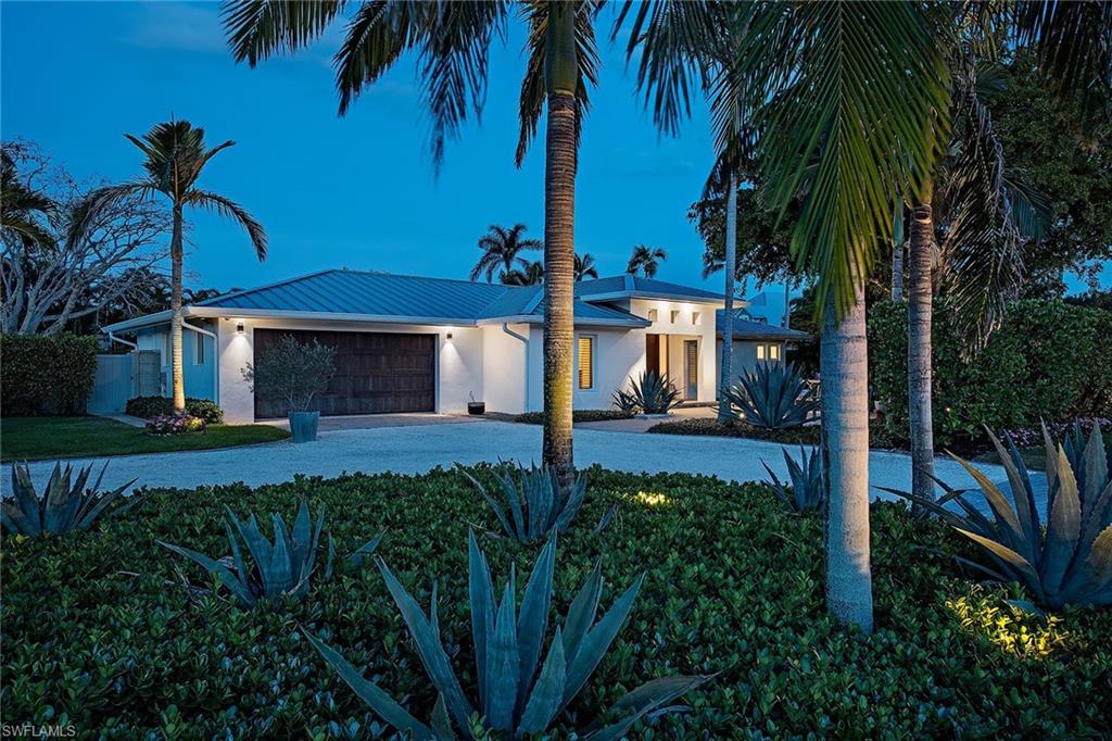 1600 Murex Lane Naples, FL 34102 - Photo 2 of 25 a view of a house with a yard and potted plants