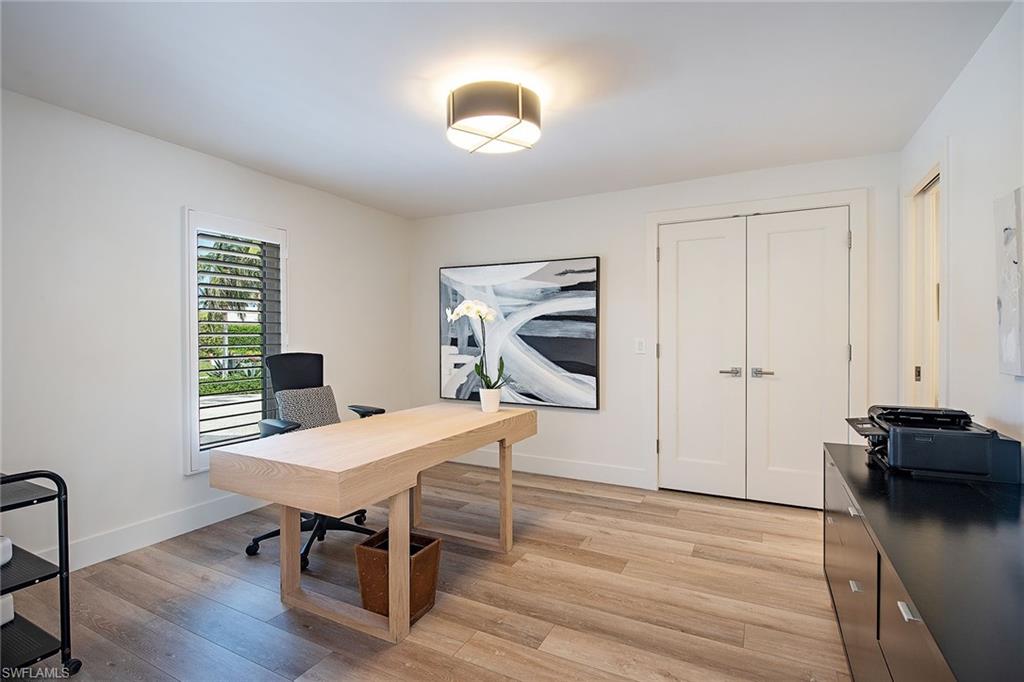 1600 Murex Lane Naples, FL 34102 - Photo 21 of 25 a workspace with furniture and wooden floor
