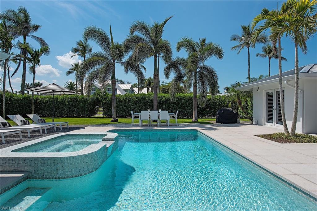 1600 Murex Lane Naples, FL 34102 - Photo 10 of 25 a view of swimming pool with palm trees