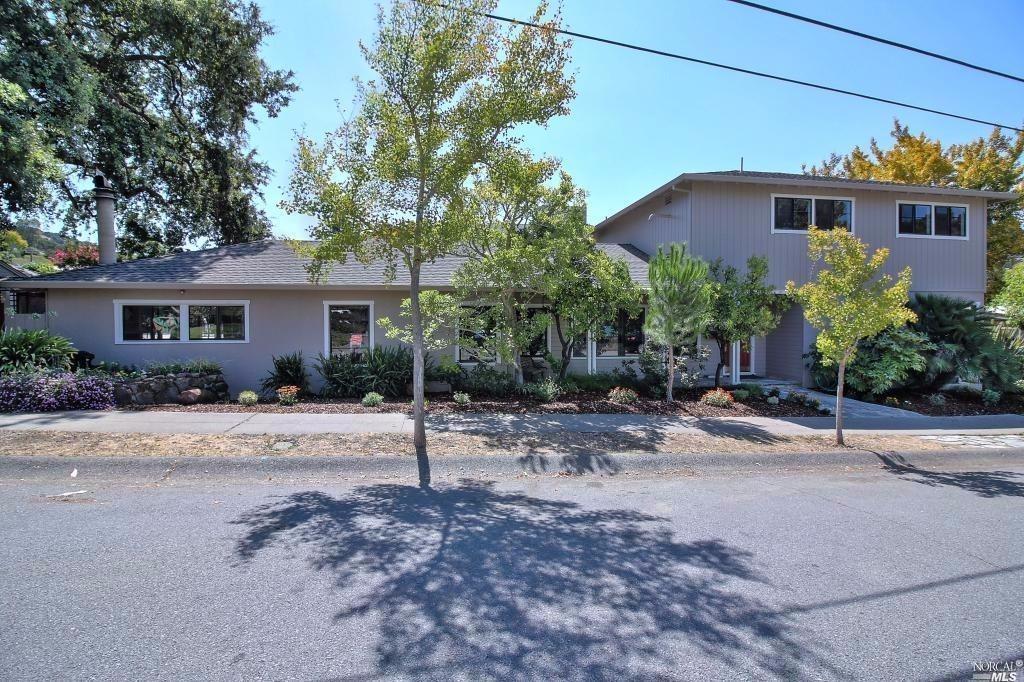 a front view of a house with a yard
