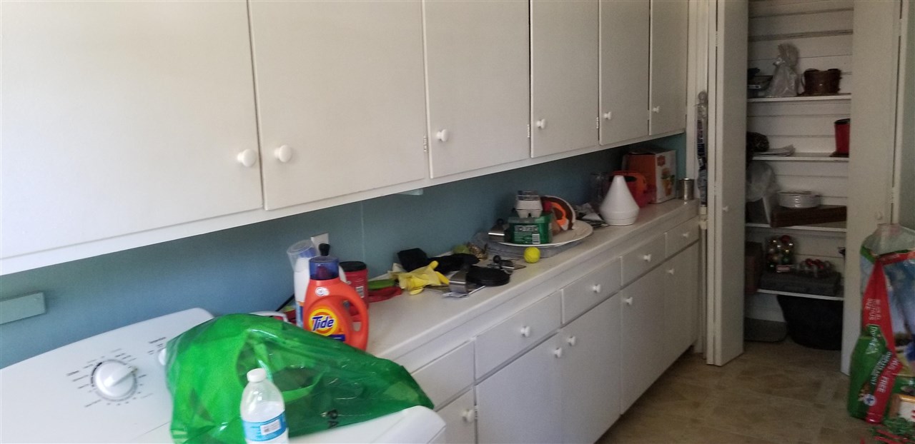 381 Aleut Street Biggs, CA 95917 - Photo 16 of 35 a kitchen with a refrigerator and cabinets