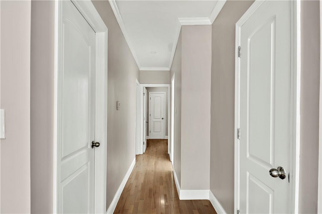 2726 Mickle Avenue Bronx, NY 10469 - Photo 13 of 16 a view of a hallway with wooden floor